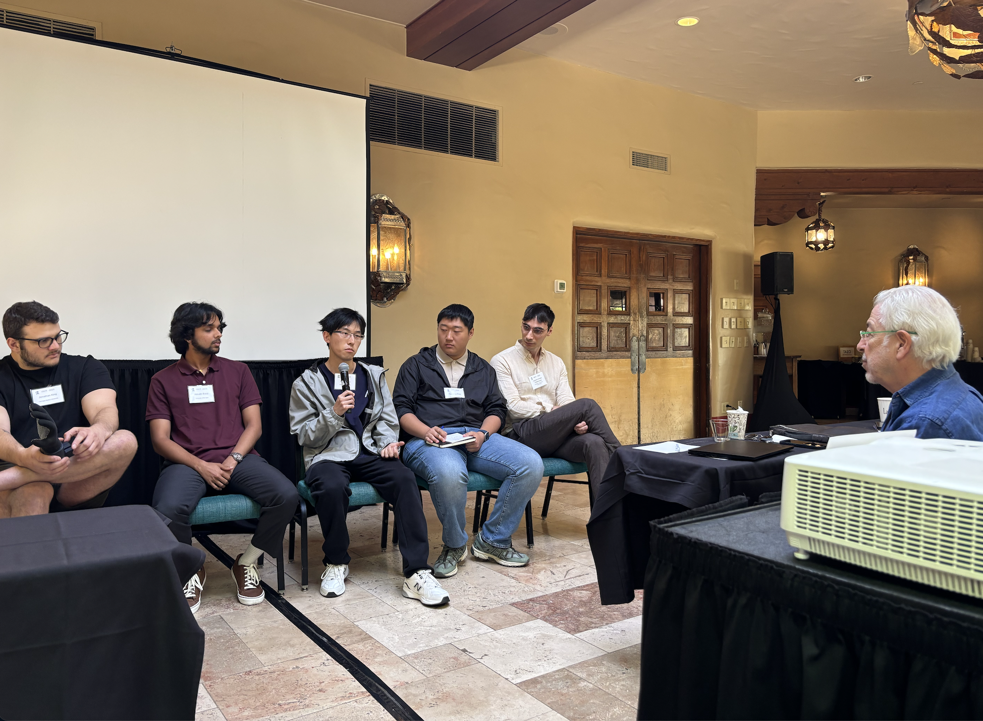 ISER 2025: Wenhao Liu and Hanyang Zhou during a panel discussion